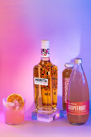 Rested Morita with a paloma cocktail on a gradient background